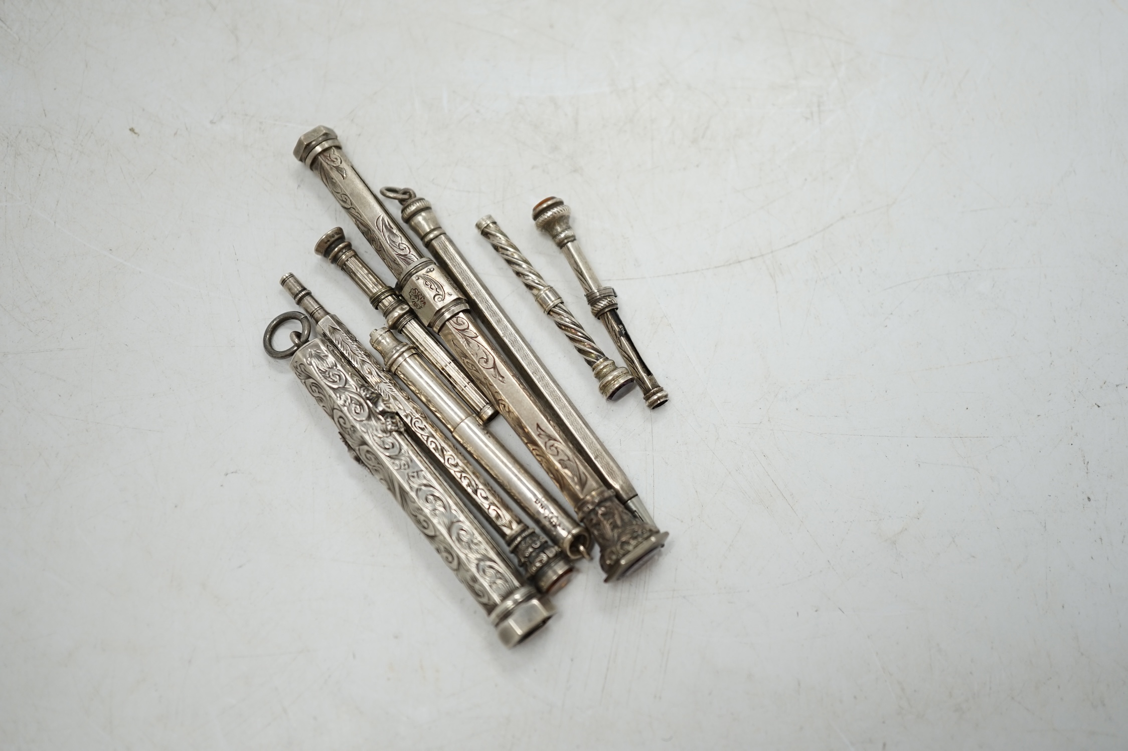 Two sterling cased propelling pencils and six other white metal cased propelling pencils, largest 91mm. Condition - fair